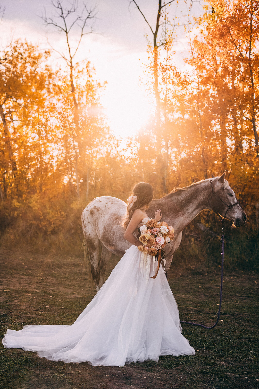 Stunning bridals with horse at River's Edge, a picturesque country wedding venue in Devon, Alberta, featured on the Brontë Bride Vendor Guide.