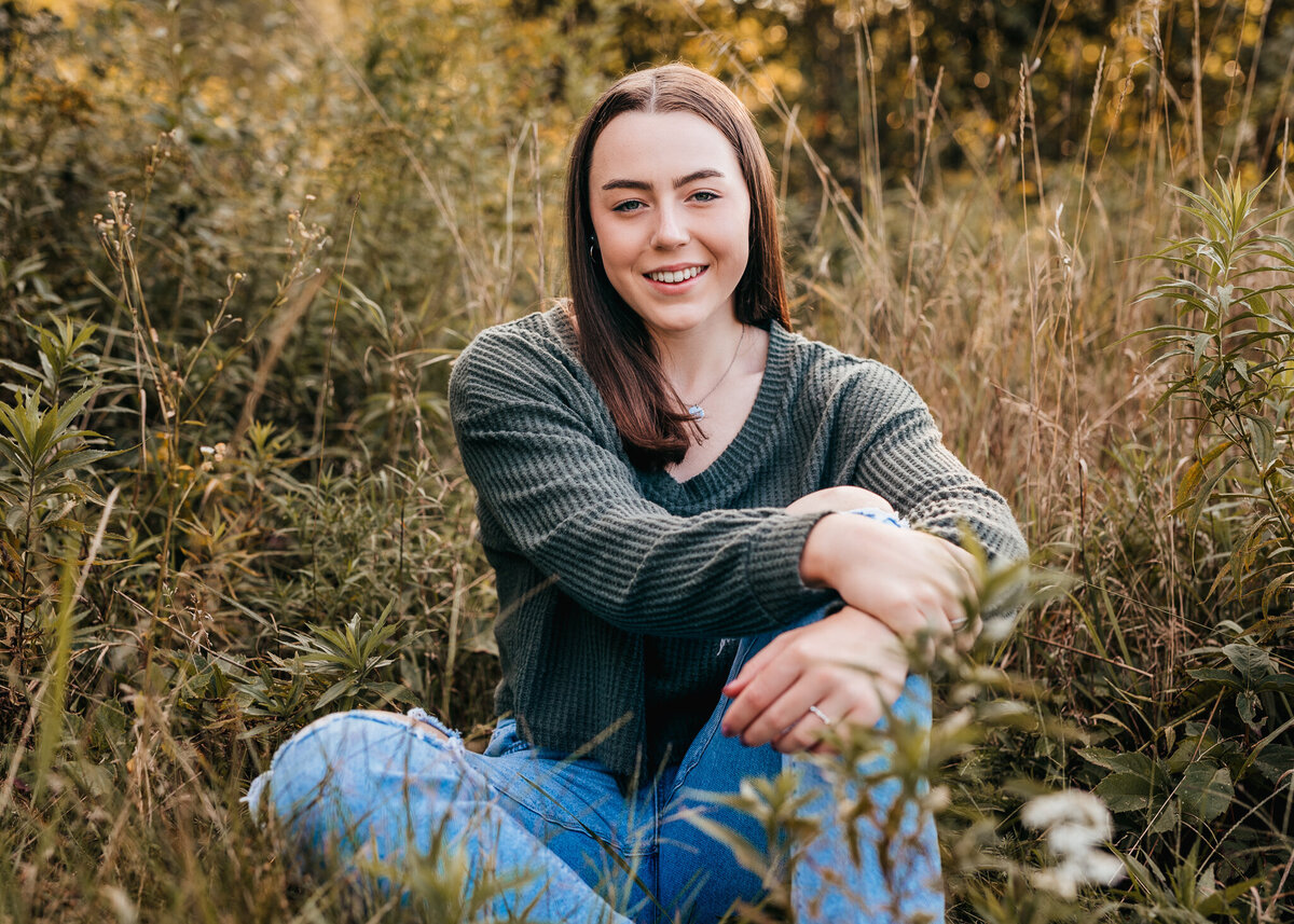 High school senior portrait in field by lisa smith photogrpaphy