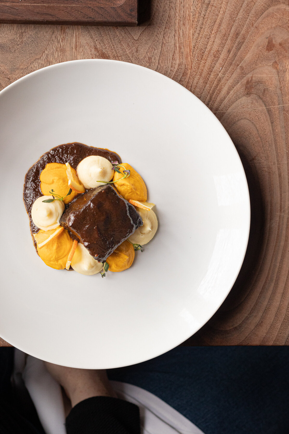 a plate of elevated steak and vegetables
