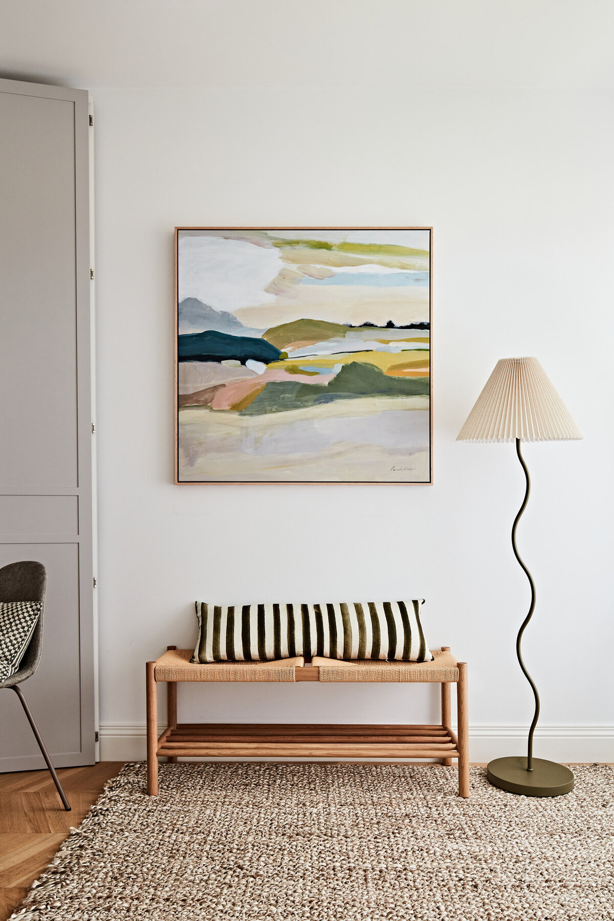 Hampton East hallway with timber bench seat, striped cushion, and wall art