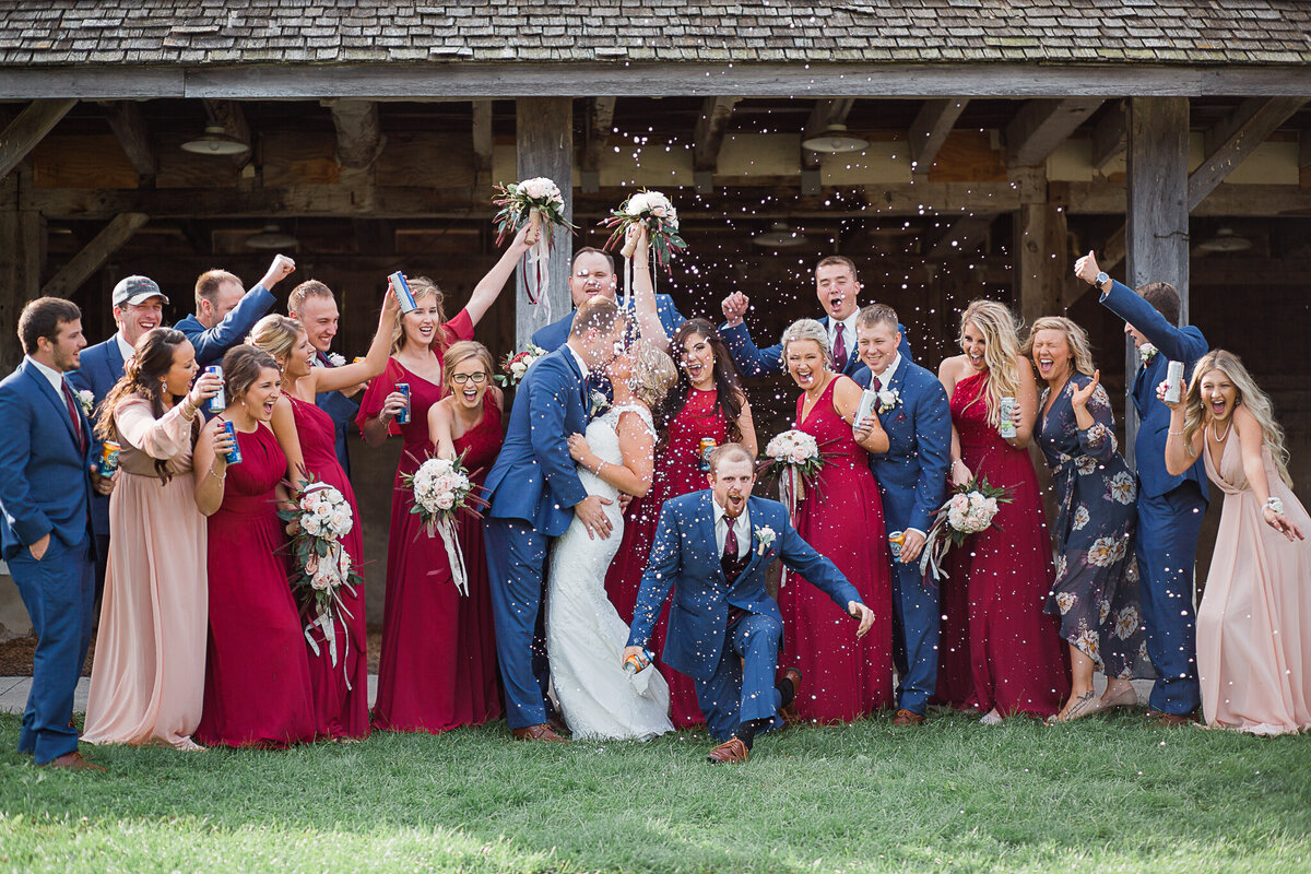 wedding-photography-bridal-party-group-shot-kissing