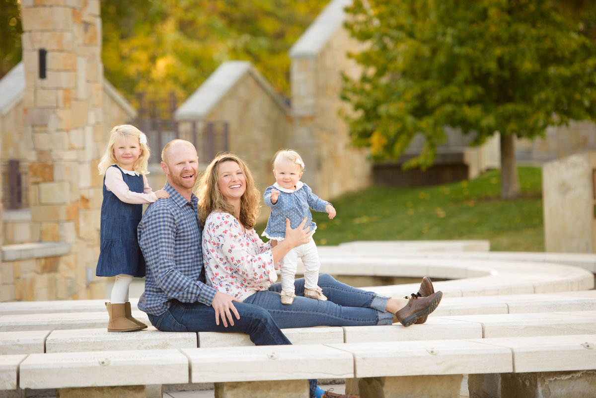 Boise family lookig at the camera and smiling during portrait photography