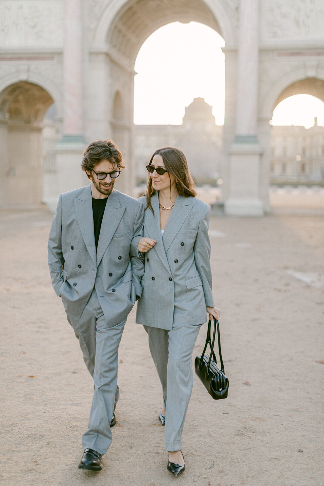 Couple photo session at the Tuileries and Louvre in Paris, showcasing timeless love and classic Parisian architecture.