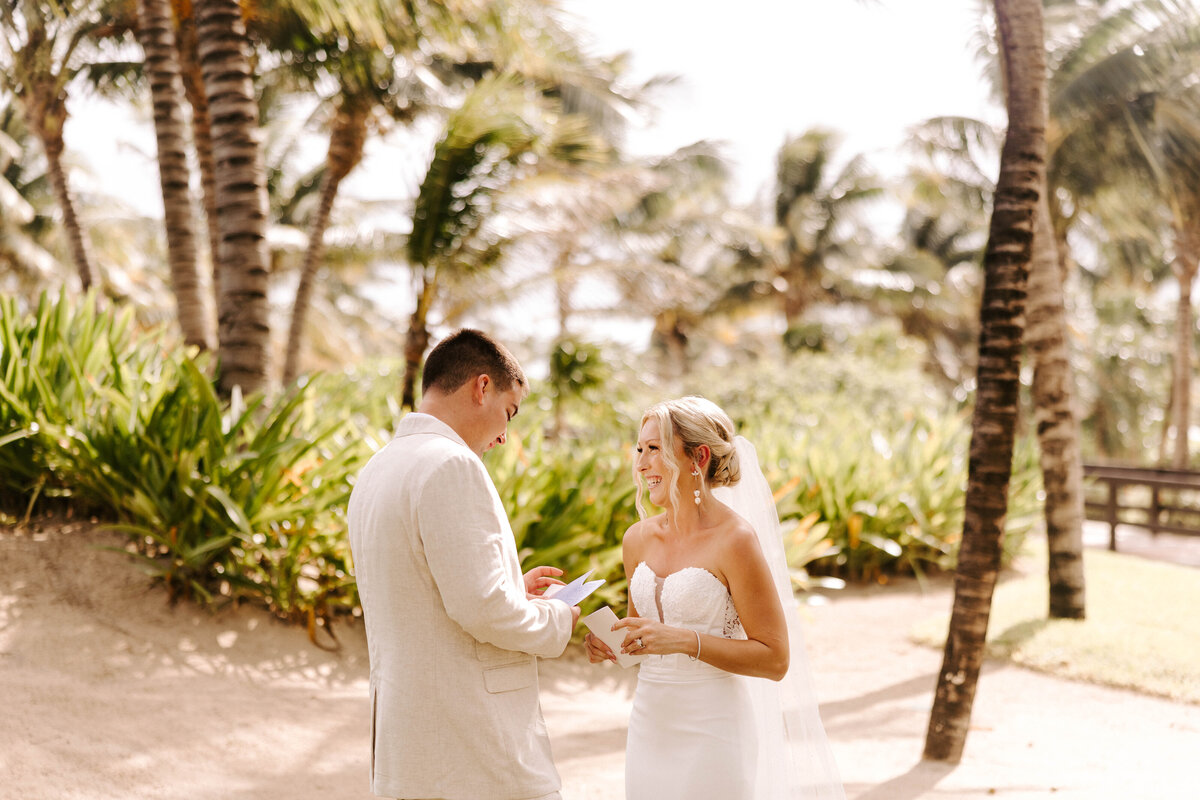 Bride and groom first look, sharing intimate moment before the wedding. Beachside wedding Cancun, Mexico