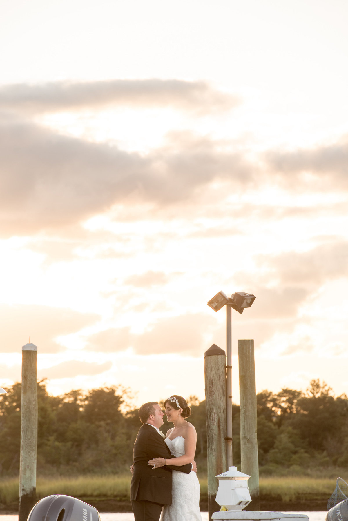 photo of bride and groom outdoors in the sunlight from wedding reception at Lawrence Yacht and Country Club