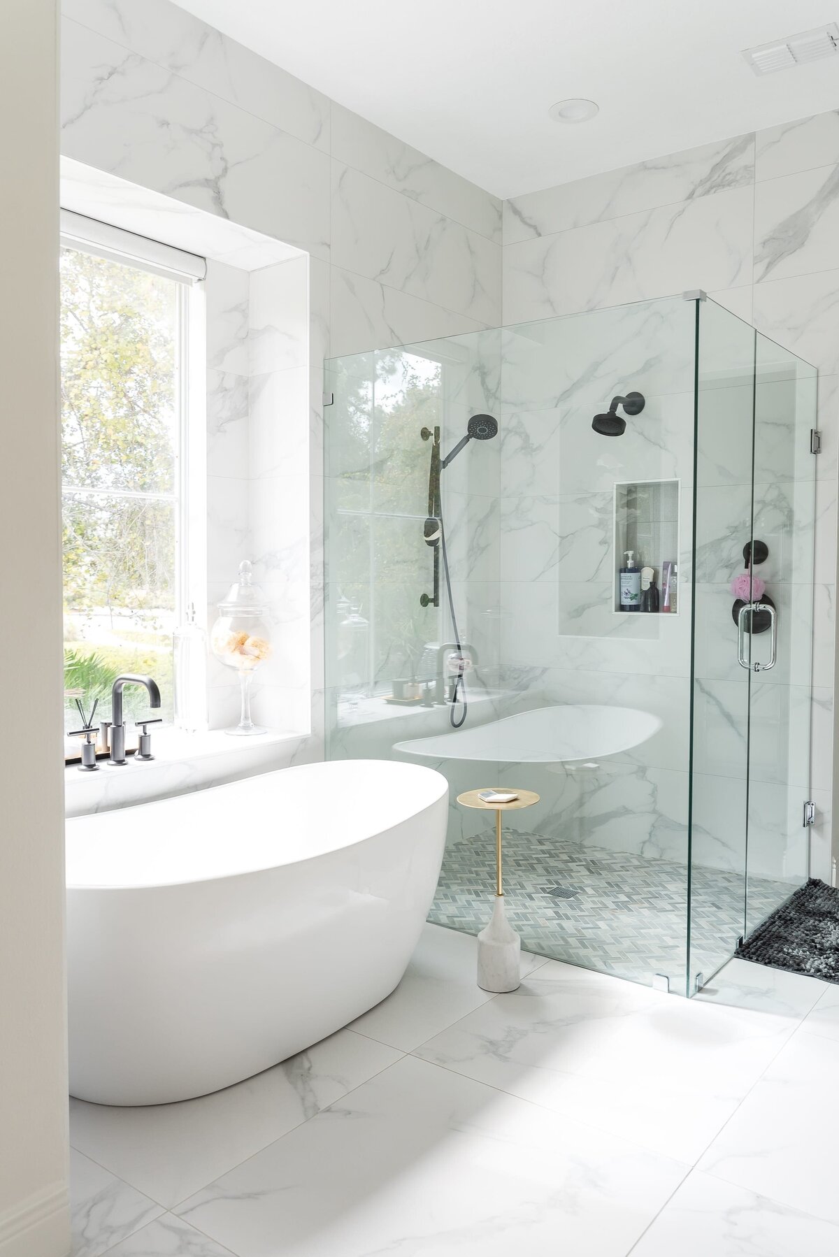 dewine design orlando interior designer modern lakehouse bathroom with standing tub and large walkin shower with marble tile