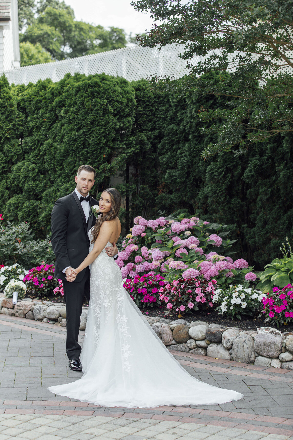 english-manor-spring-wedding-photo-bride-groom-holding-hands-flowers-ocean-township-new-jersey