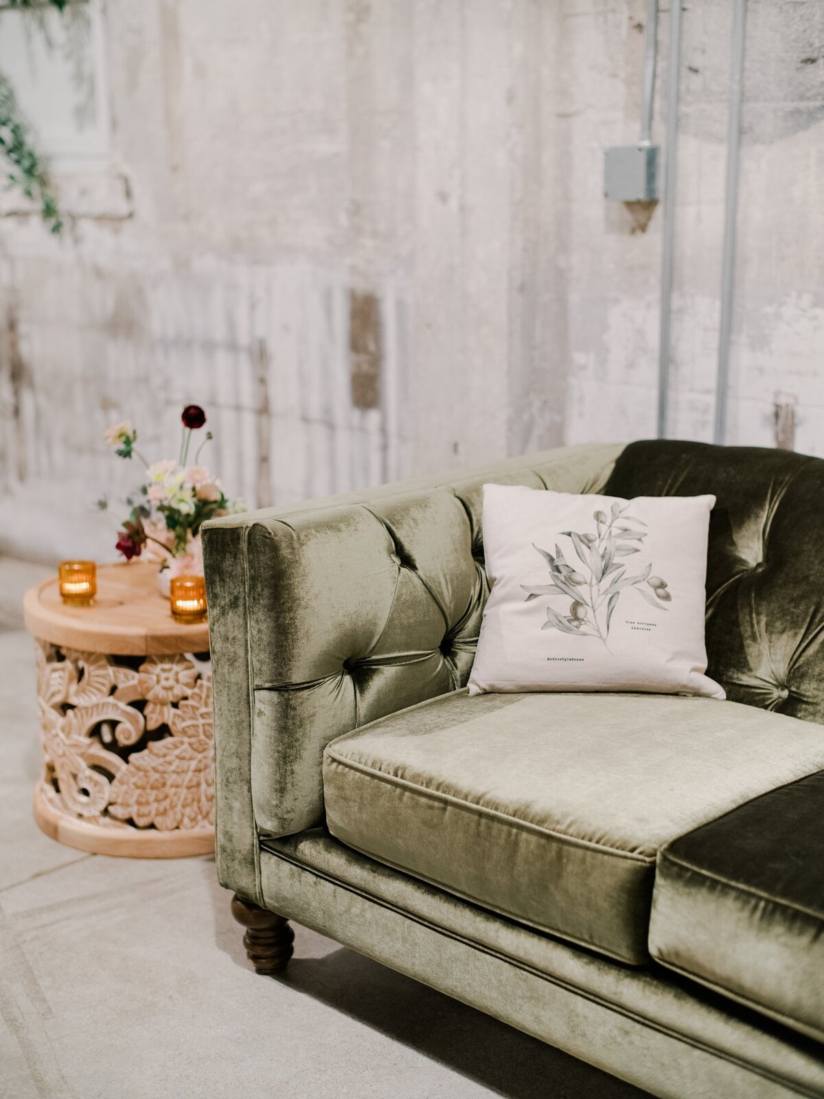 Green velvet couch at luxury event