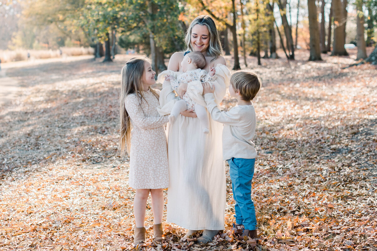 mom with kids in field