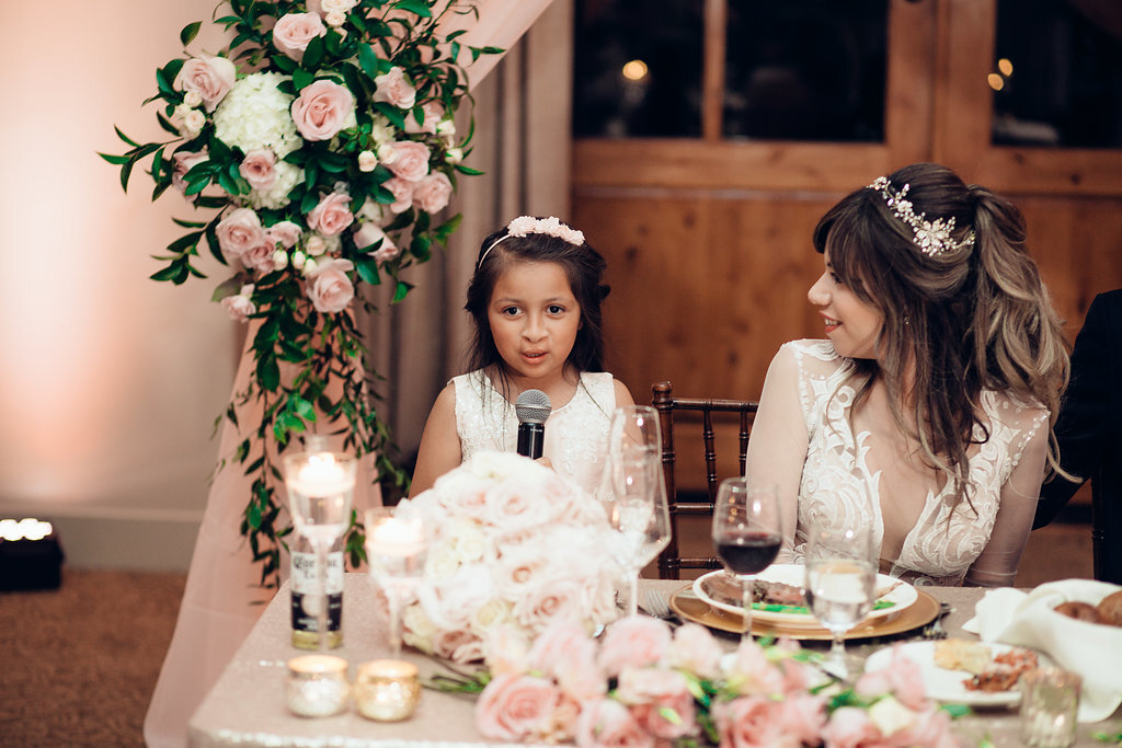 Wedding Photograph Of Bride Looking At The Child Speaking In The Microphone Los Angeles