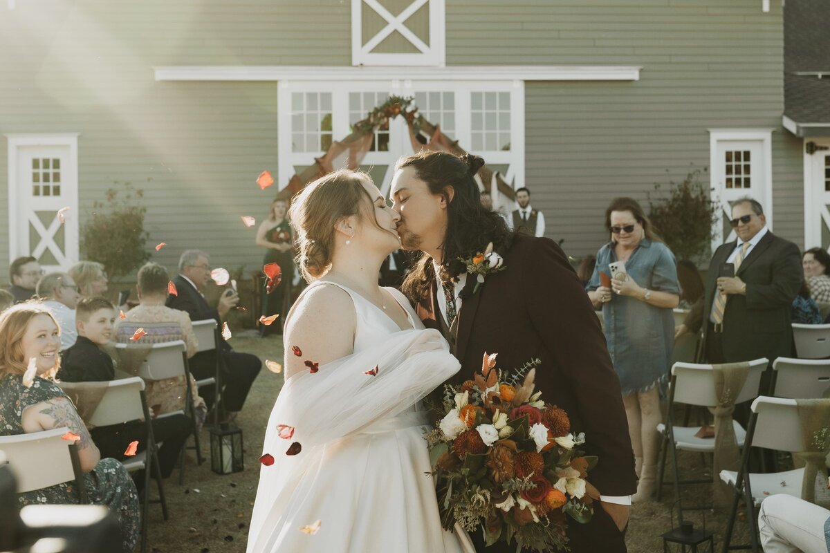 bride and groom ceremony kiss