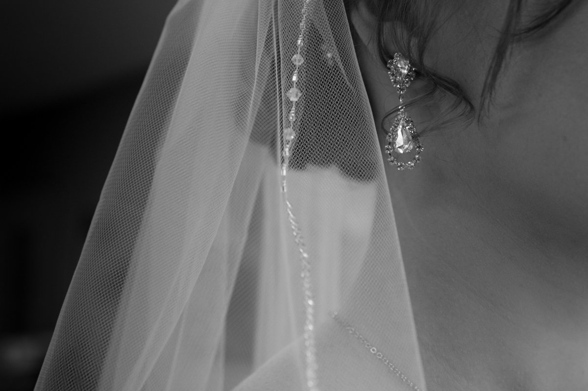 brides simple elegant earring on ear pic