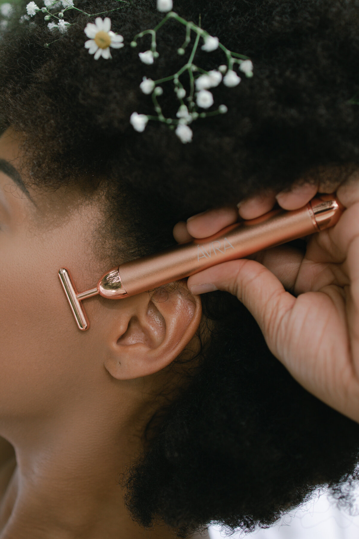 Rose gold t bar for face sculpting and tightening review by Alex Perry skincare brand videographer and photographer