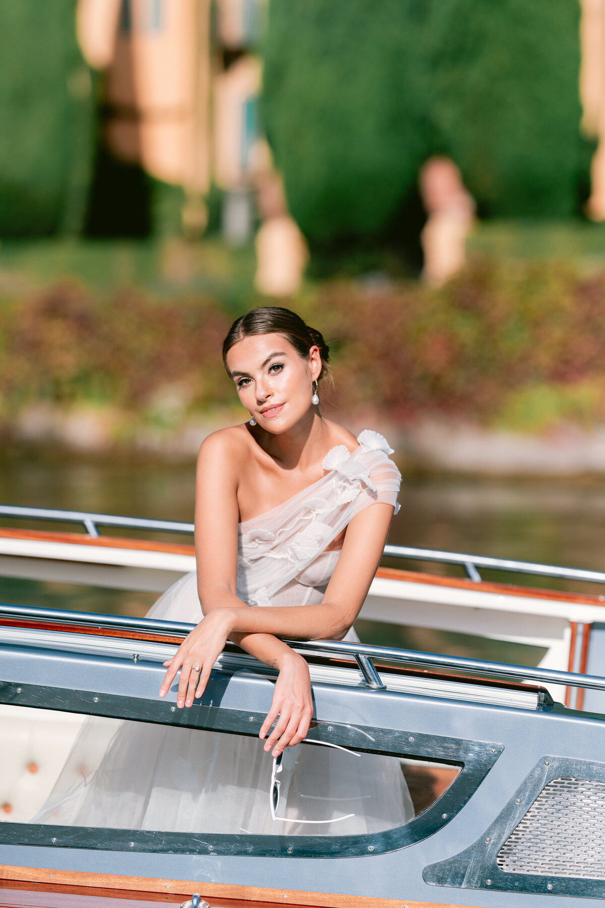 Bride on a private boat on lake como, italy