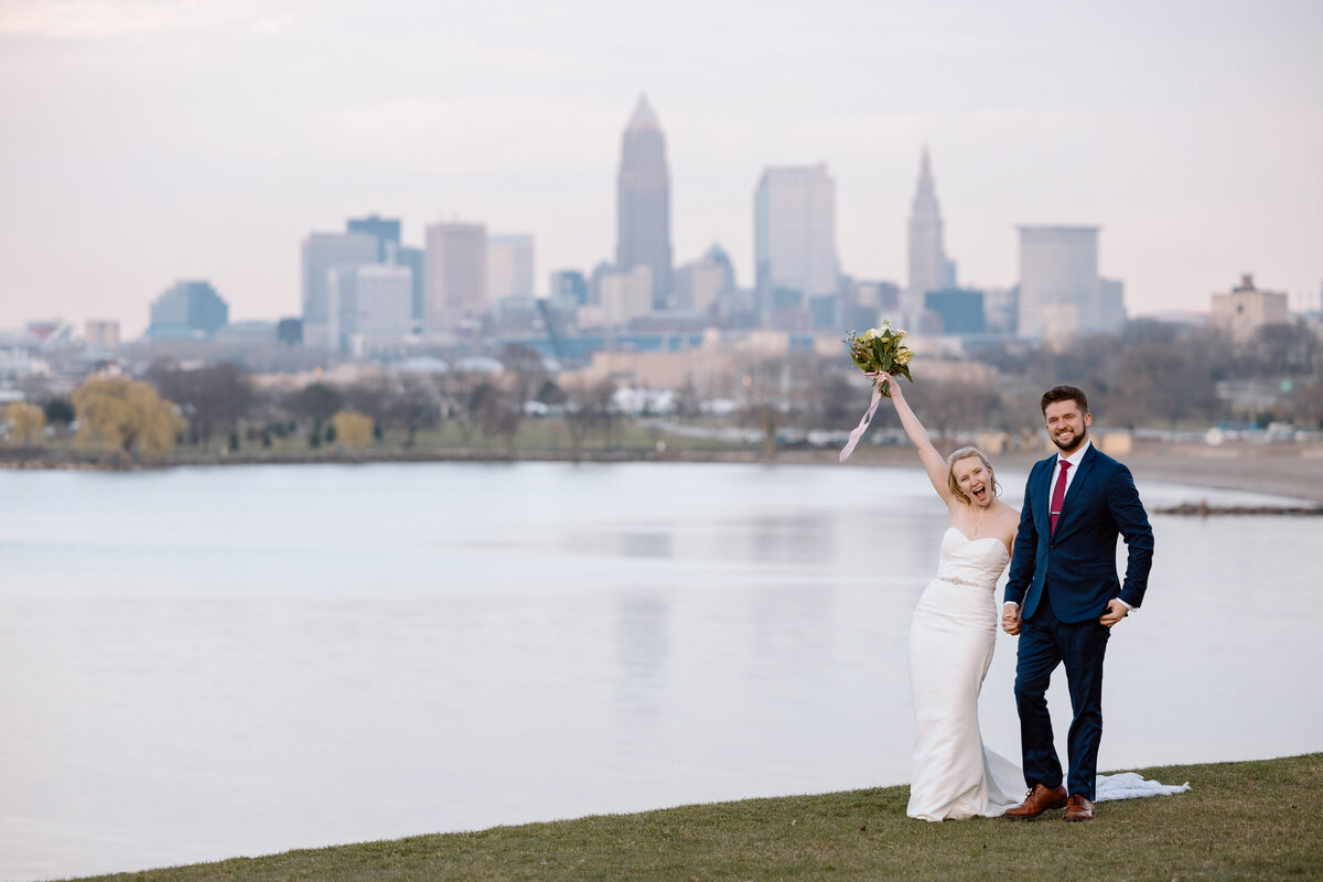 Bride and groom walking at Edgewater Park in Cleveland.