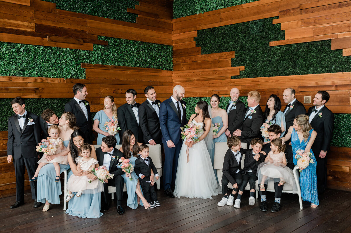 Wedding party poses together smiling at the William Vale 