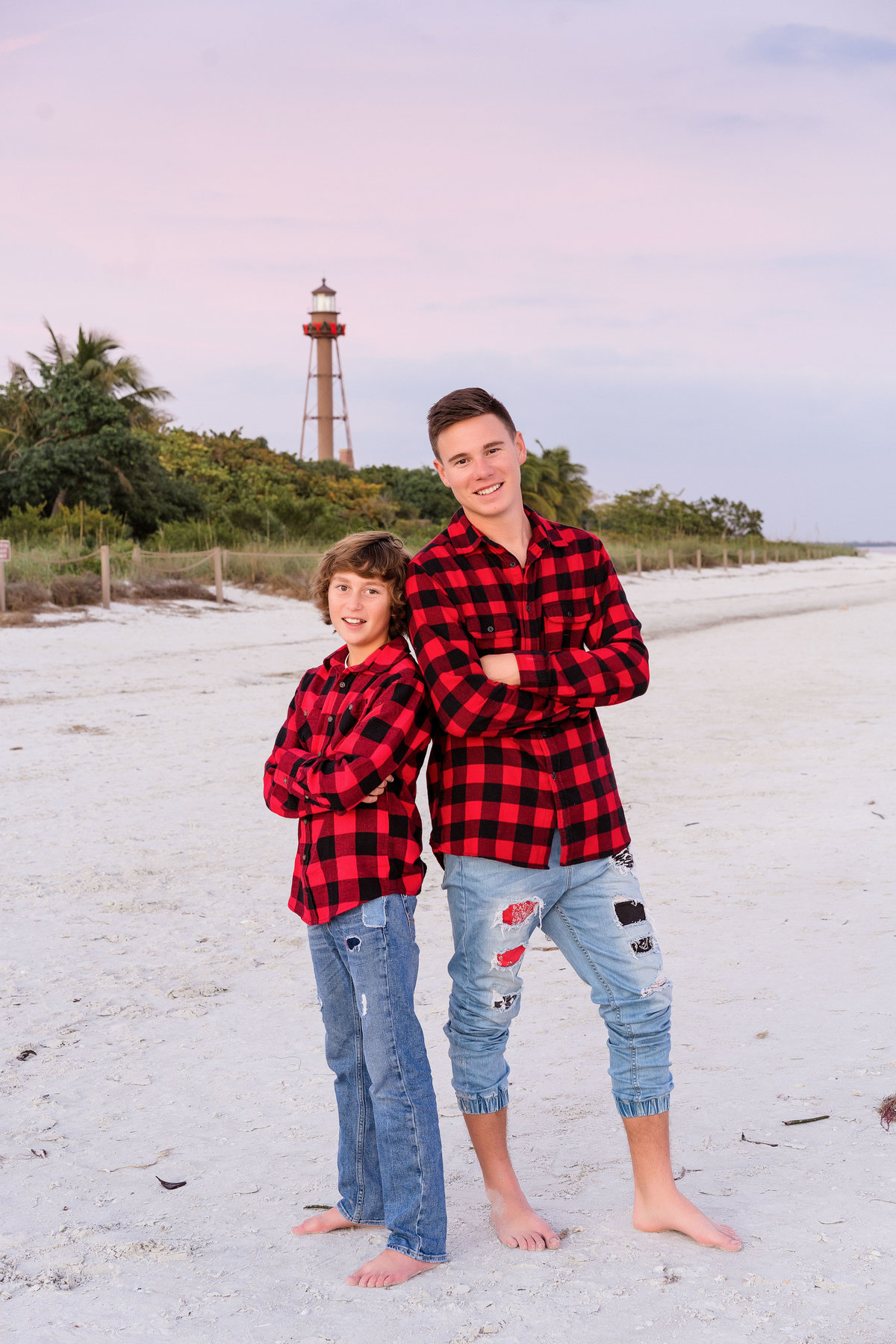 Brothers in front of the Sanibel Lighthouse at Christmas in Sanibel Beach Florida