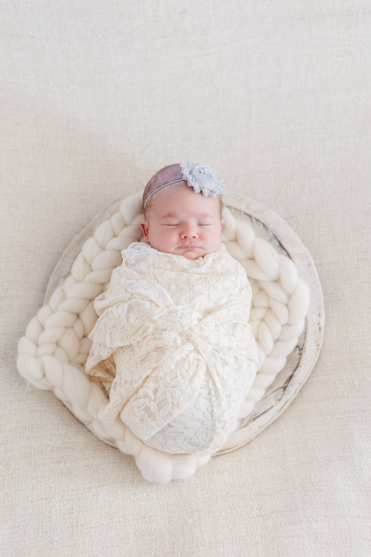 Baby girls sleeping cover with a white drape