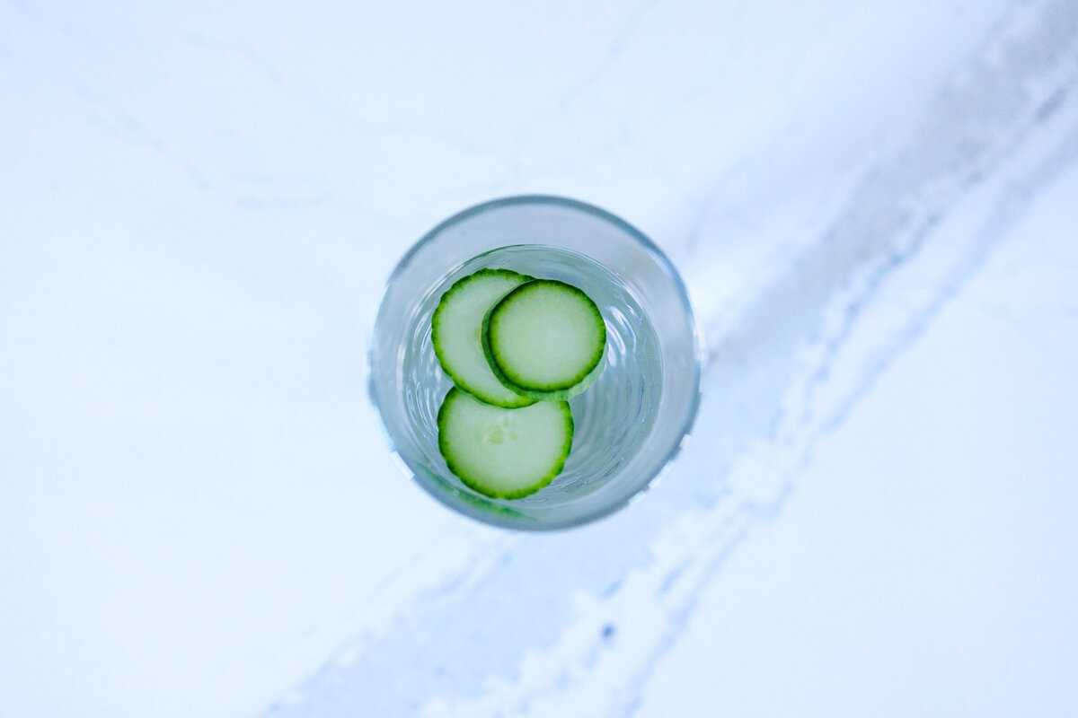 Water and cucumber in glass