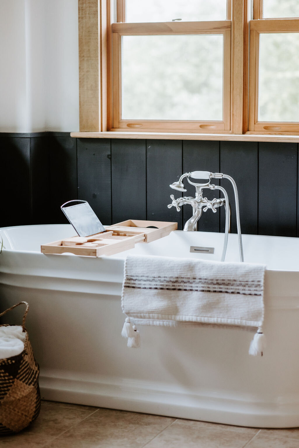 freestanding soaking bathtub with vintage inspired nickle faucet in the modern farmhouse overnight accommodation at Willowbrook wedding venue