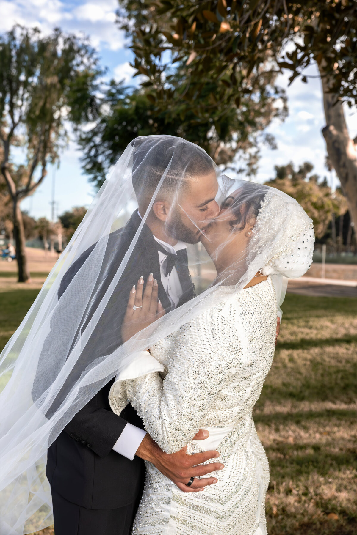 Romantic Veil Moment – Bride and Groom Laughing Together at LA Arabian Wedding