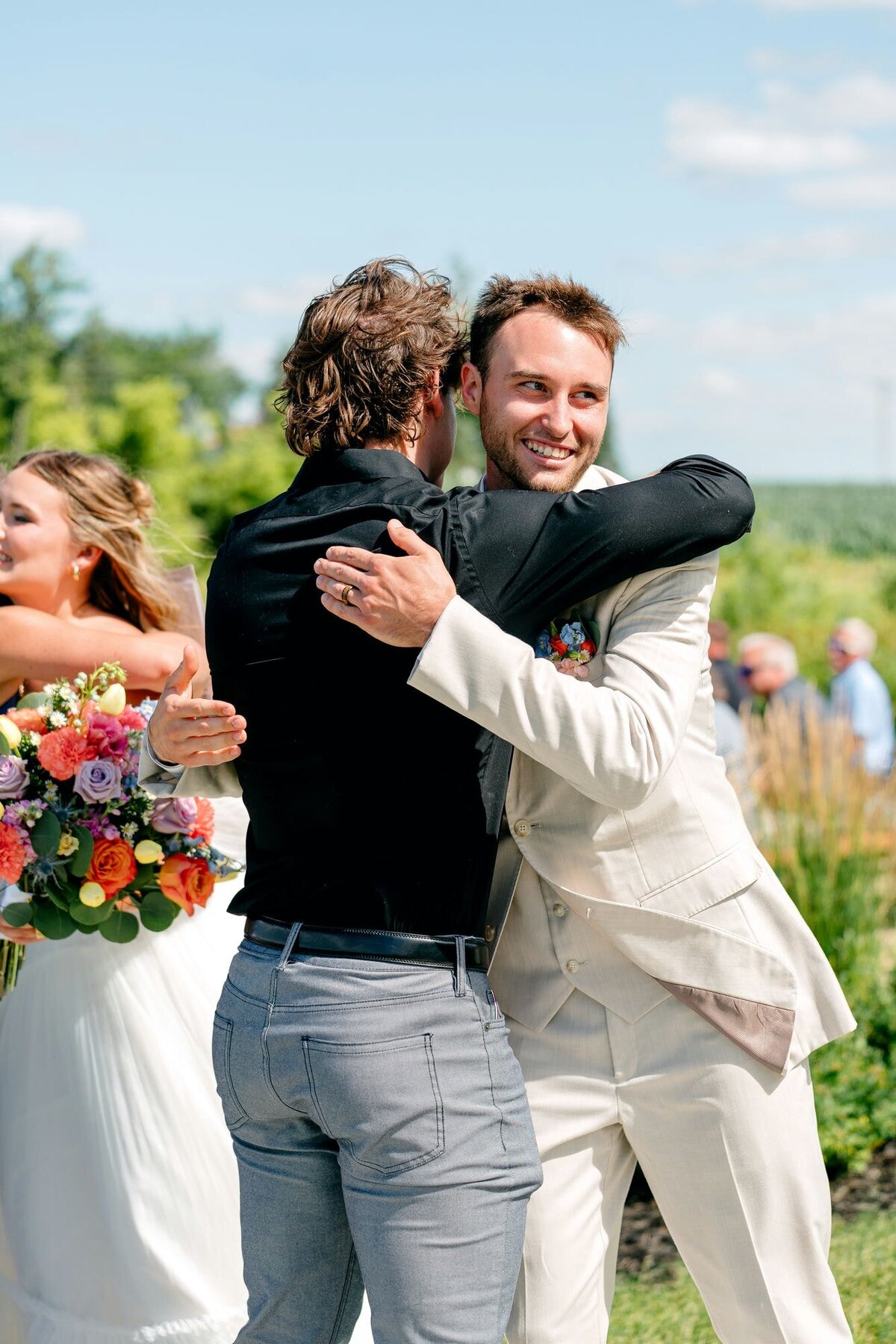 groom-hugging-his-guest