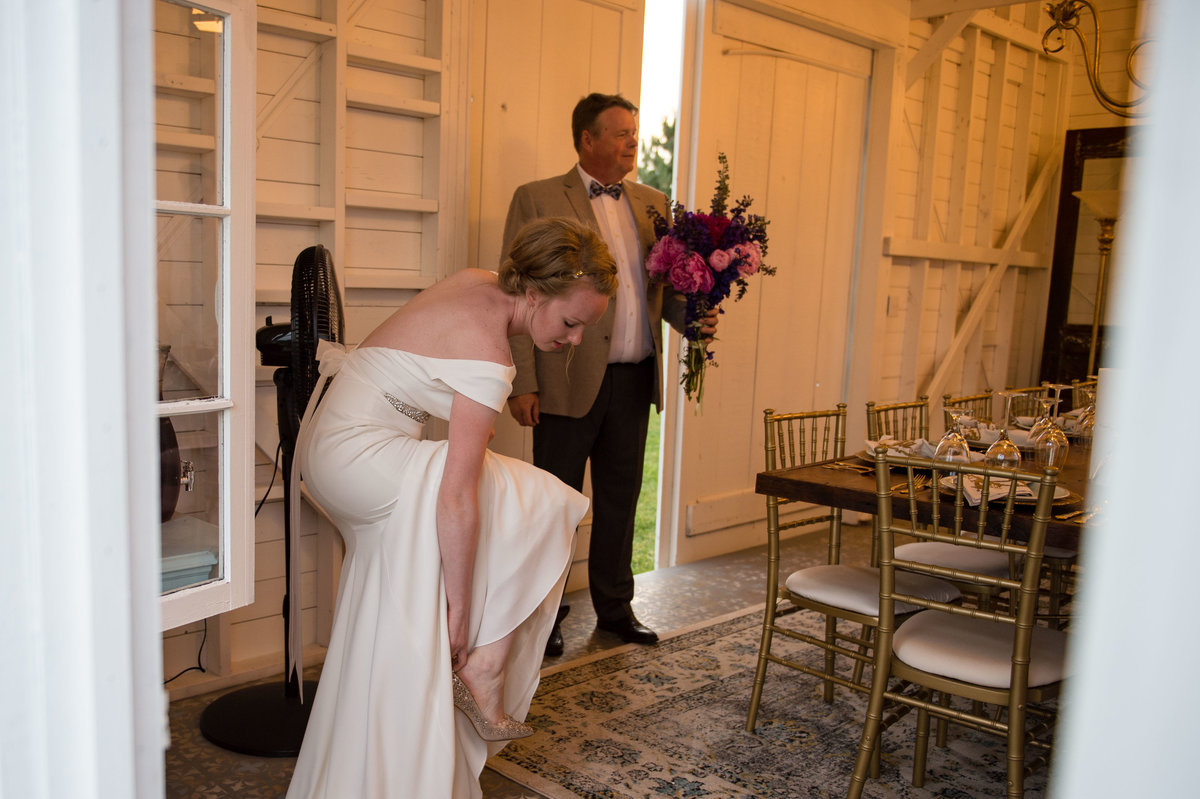 bride fixes shoe