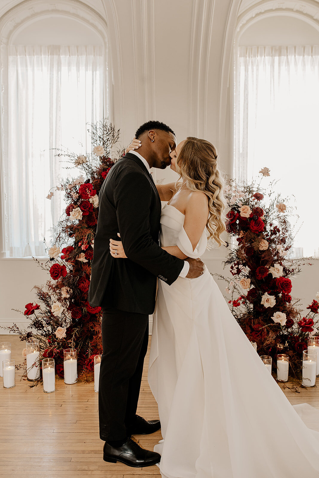 "Bride and groom celebrate their elegant luxury wedding at the historic Cottonwood Hotel in Omaha, NE – timeless moments captured by Tori Nichole Photography. A perfect blend of sophistication, romance, and architectural charm, showcasing the couple's love story in an unforgettable setting.