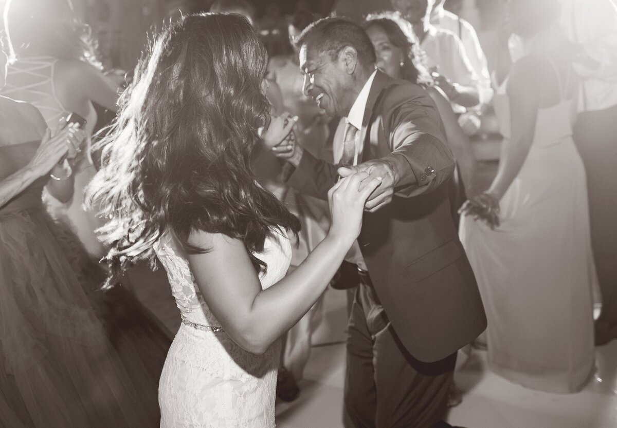 Bride dancing with fatehr at wedding reception in Cancun