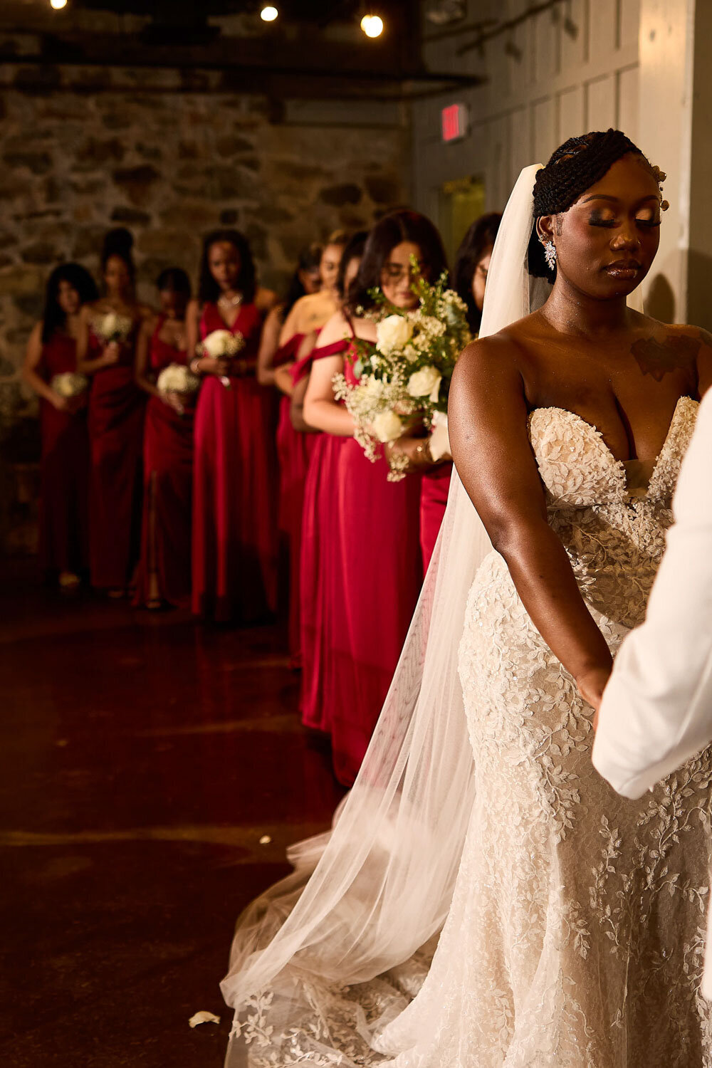 Bride closing her eyes in wedding ceremony