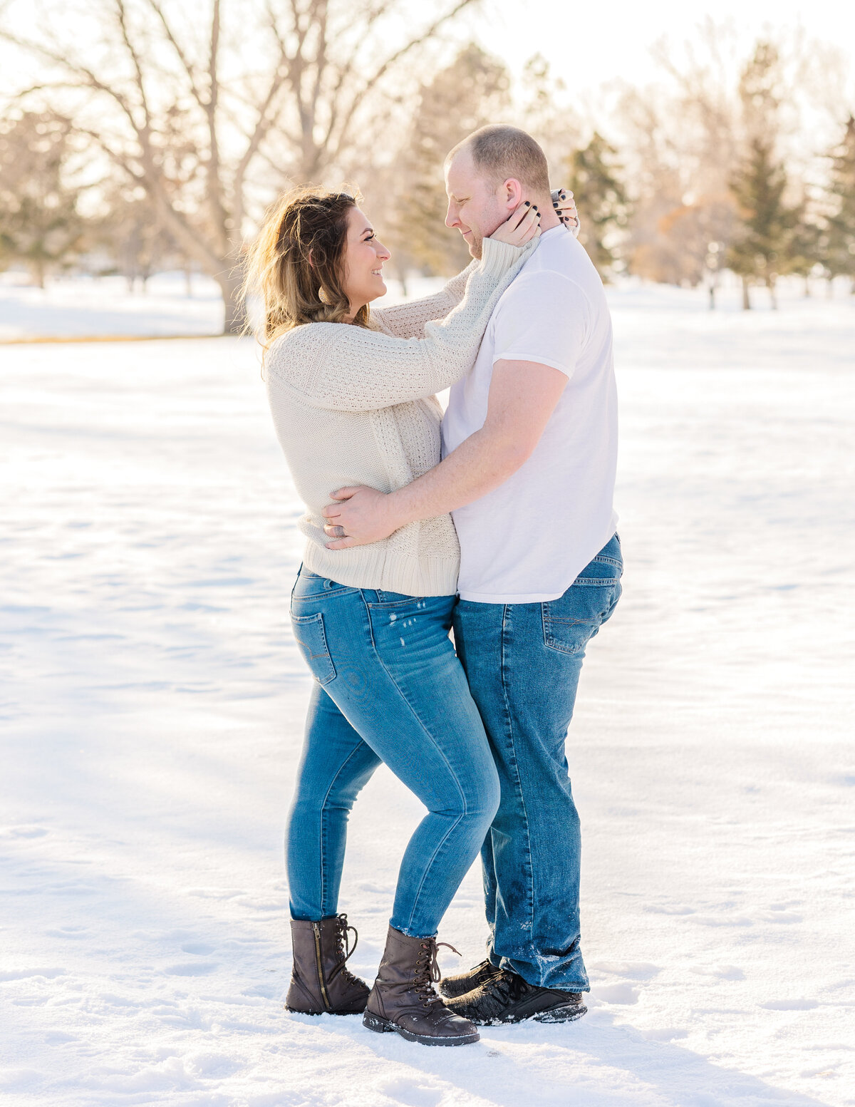 Colorado Springs Family Photographer - Couple embracing each other in the snow