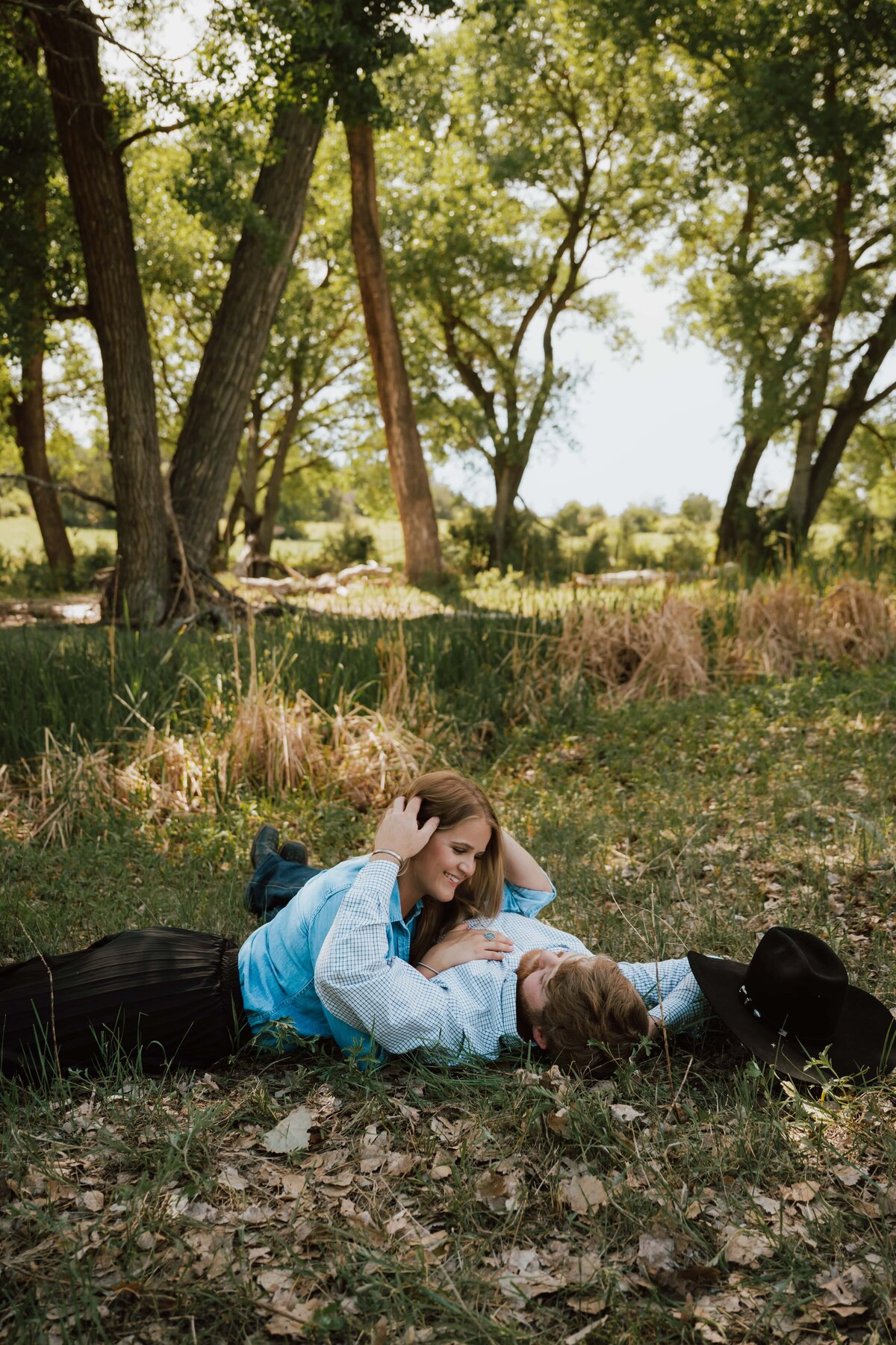 couple in grass amarillo texas engagement session