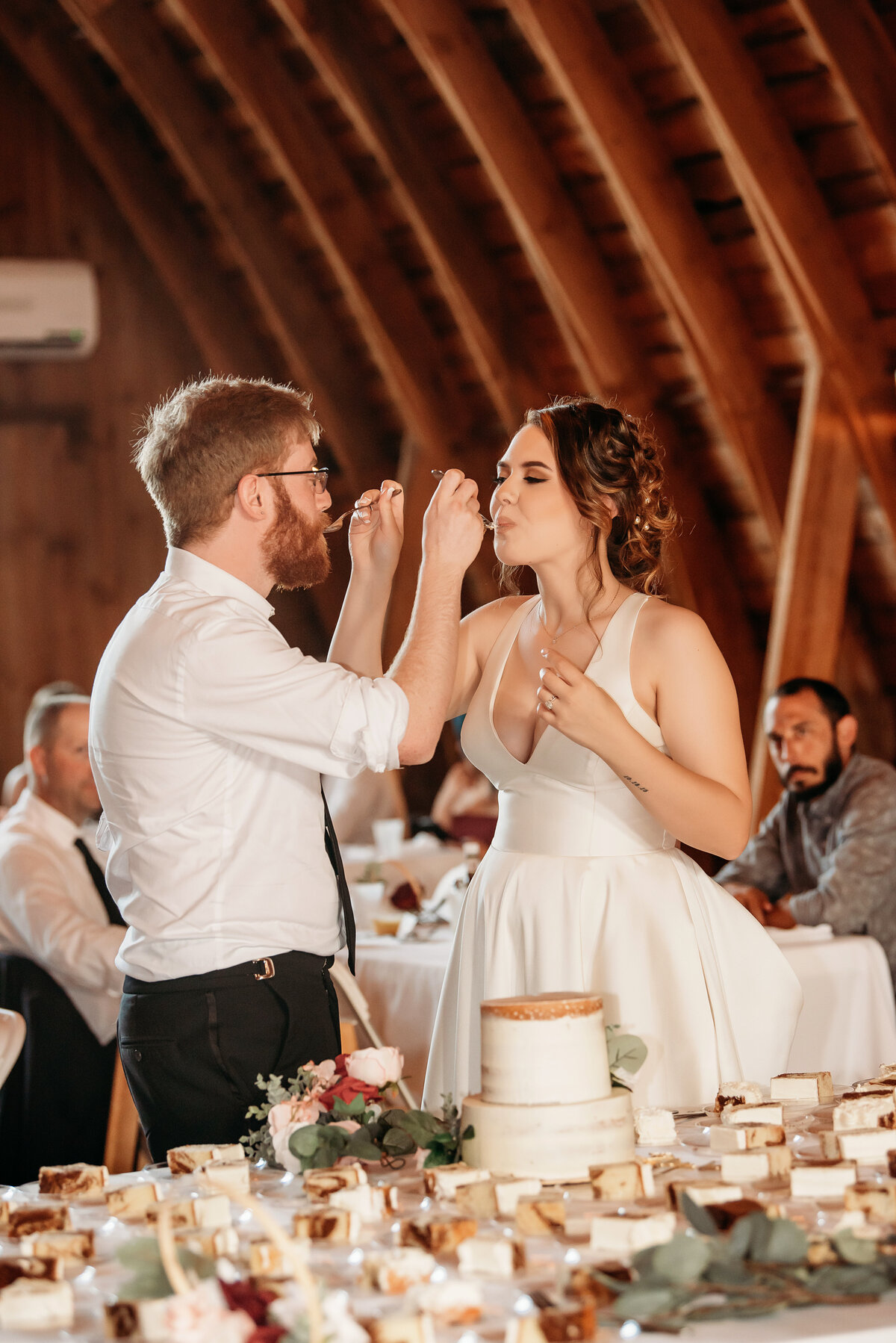 Vesper-and-Vow-Bemidji-Minnesota-wedding-and-elopement-photographer-coordinator-planner-elegant-cake-first-bite