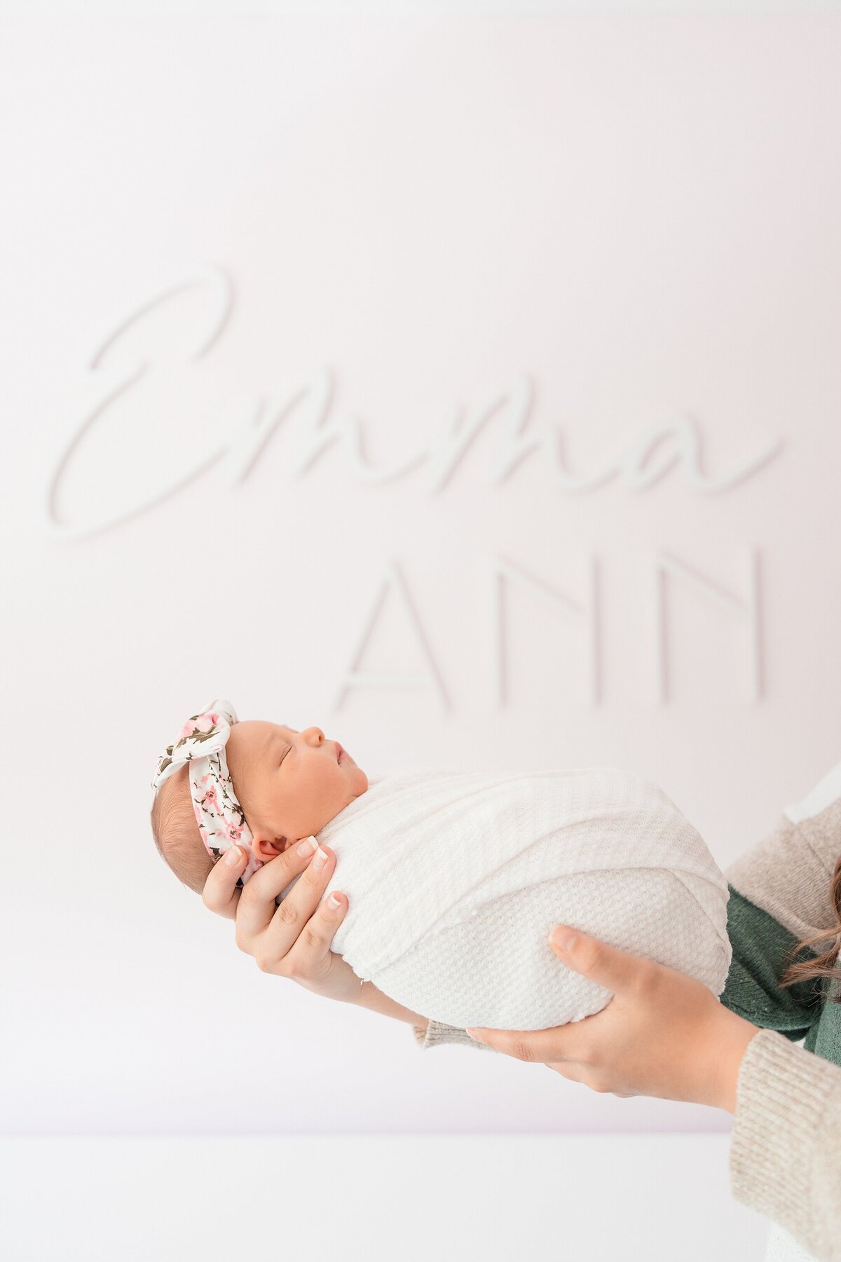 newborn with name sign