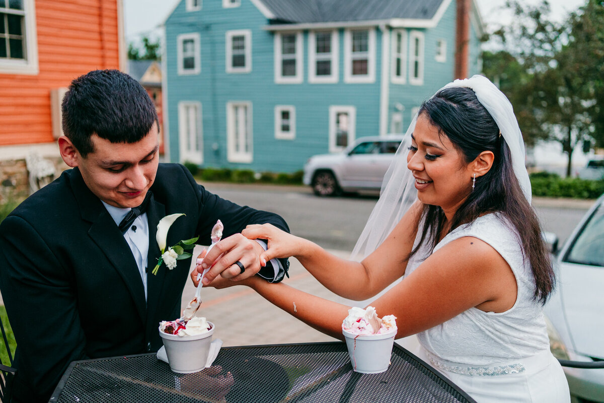 Couple enjoying milkshakes at an outdoor ice cream bar
