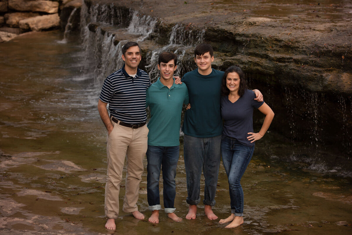 family-in-blues-standing-by-waterfall-at-airfield -falls
