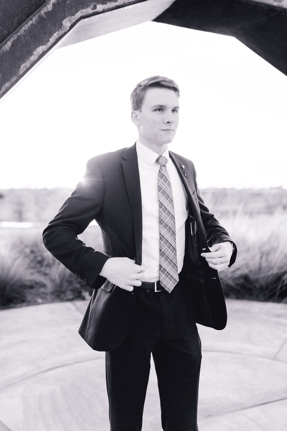 Austin senior boy in suit and tie. Outside in Austin Texas.