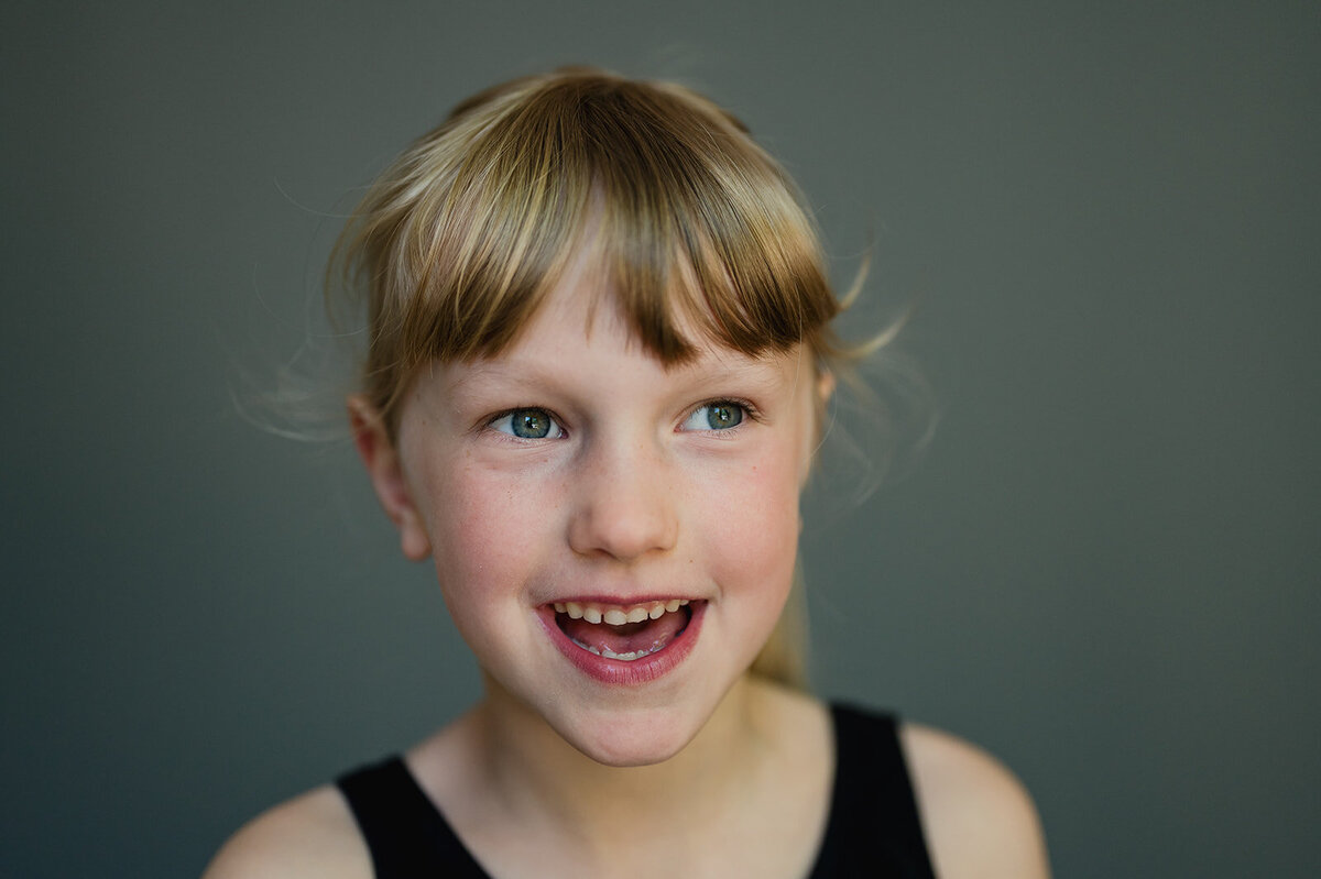 Fine art school photo of a young boy, captured with a minimalist style in Connecticut