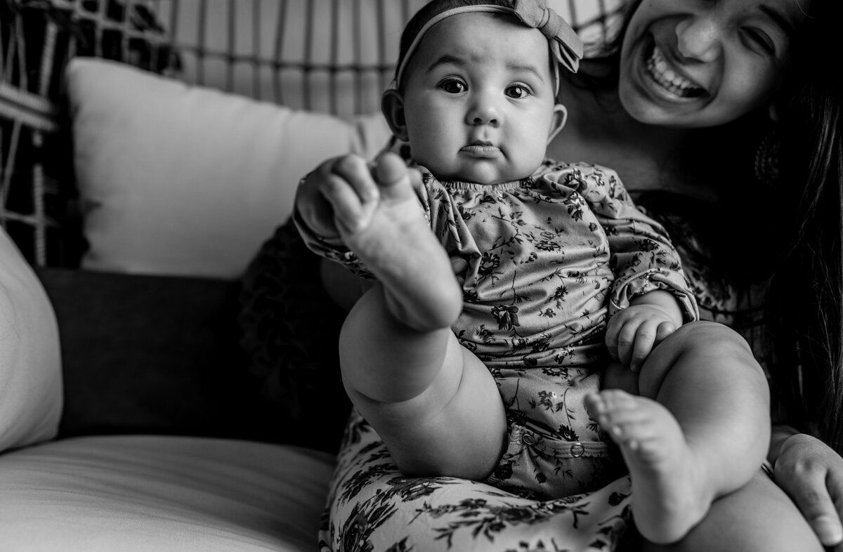 black and white photo of baby and her mommy in Hollman AF base