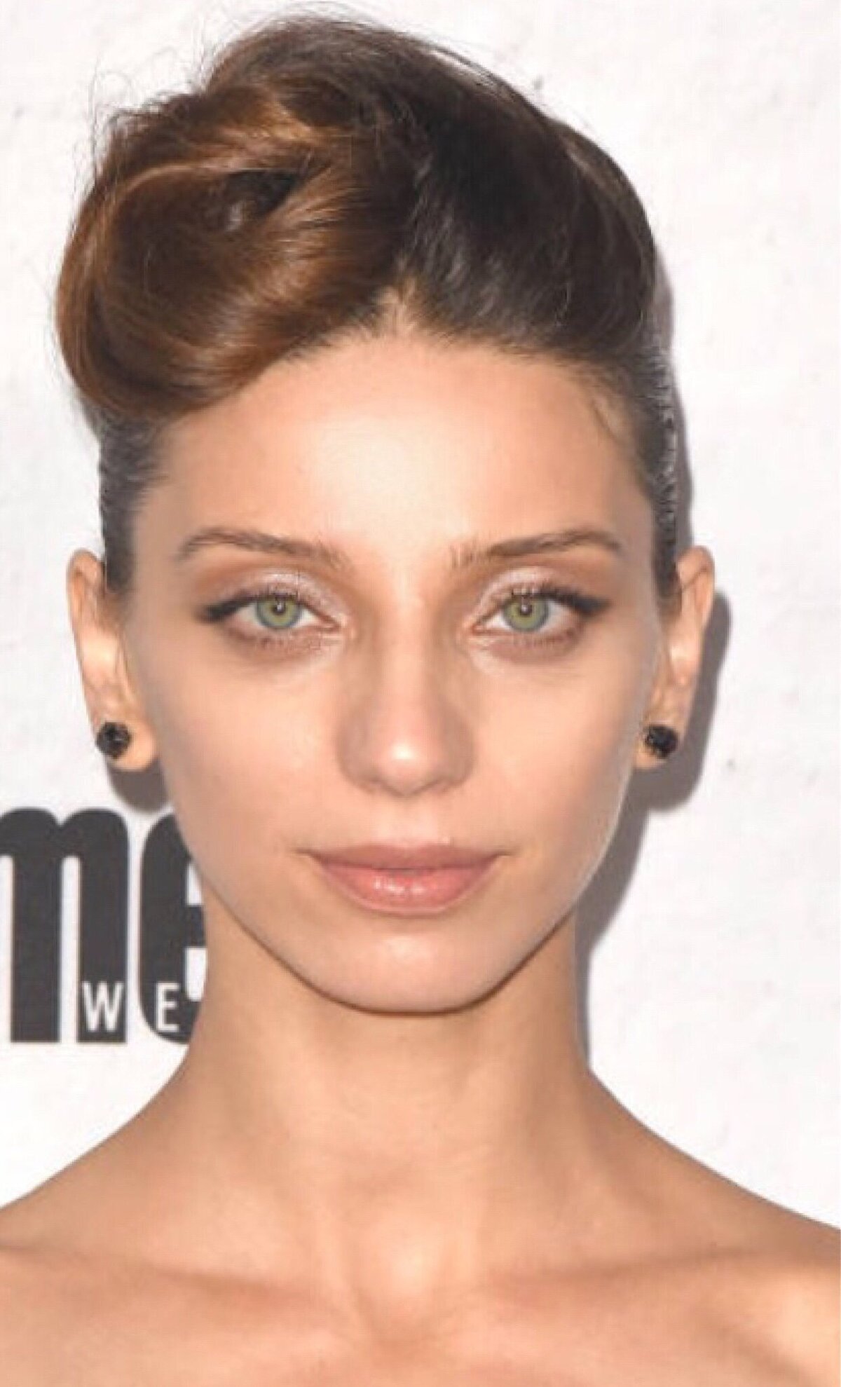Angela Sarafyan wearing natural makeup , hair up and a black pant suit to the Entertainment Weekly party