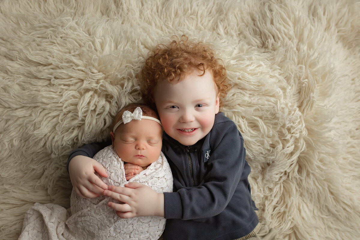 Big brother with new baby sister.