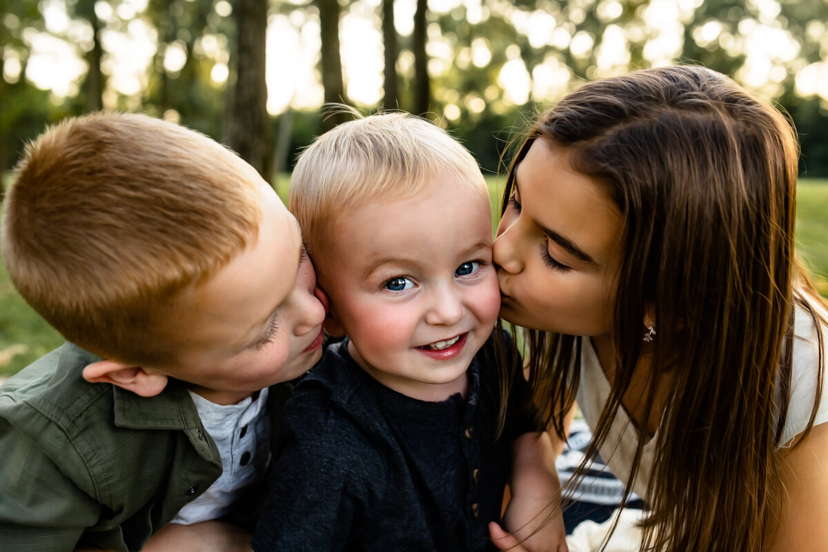 Kids kissing baby brother at Centennial Park, Munster Indiana