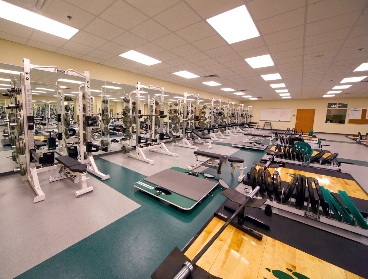 inside the weight room at the Wesleyan School Athletics building