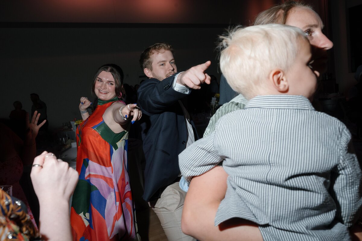 wedding-guests-dance-floor-pointing-at-kid-wedding