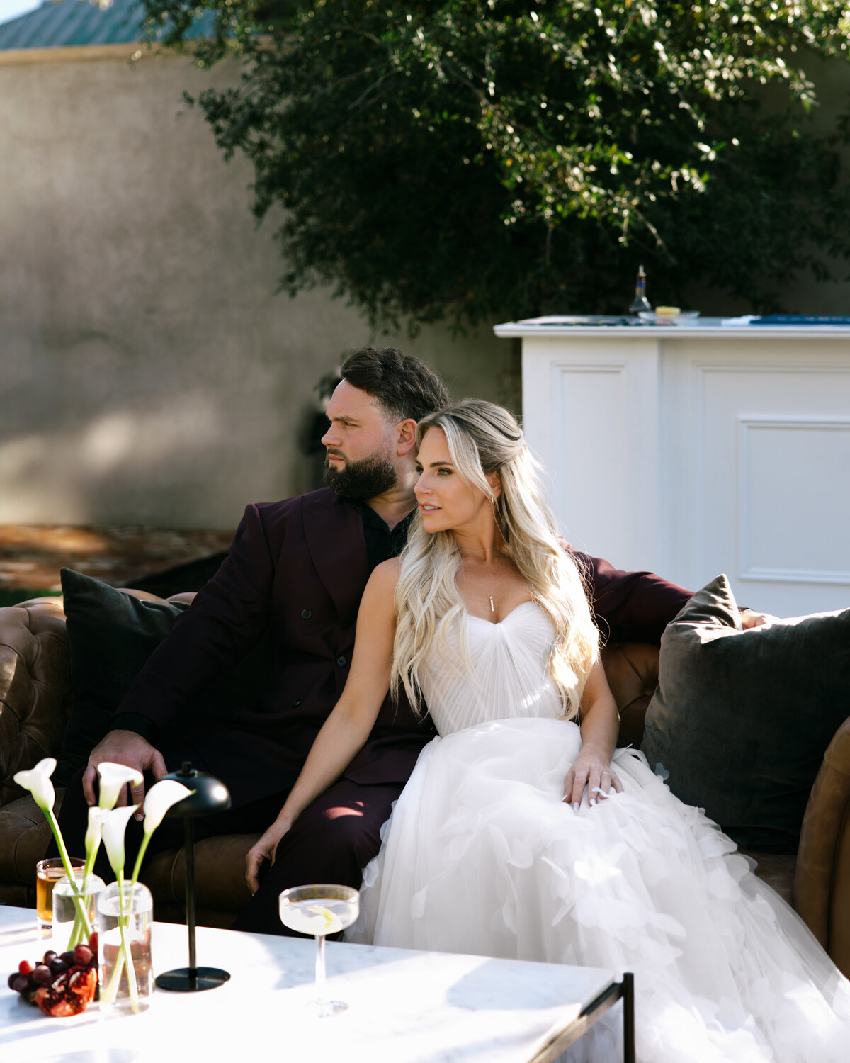 bride and groom pose for wedding photographer in an editorial style
