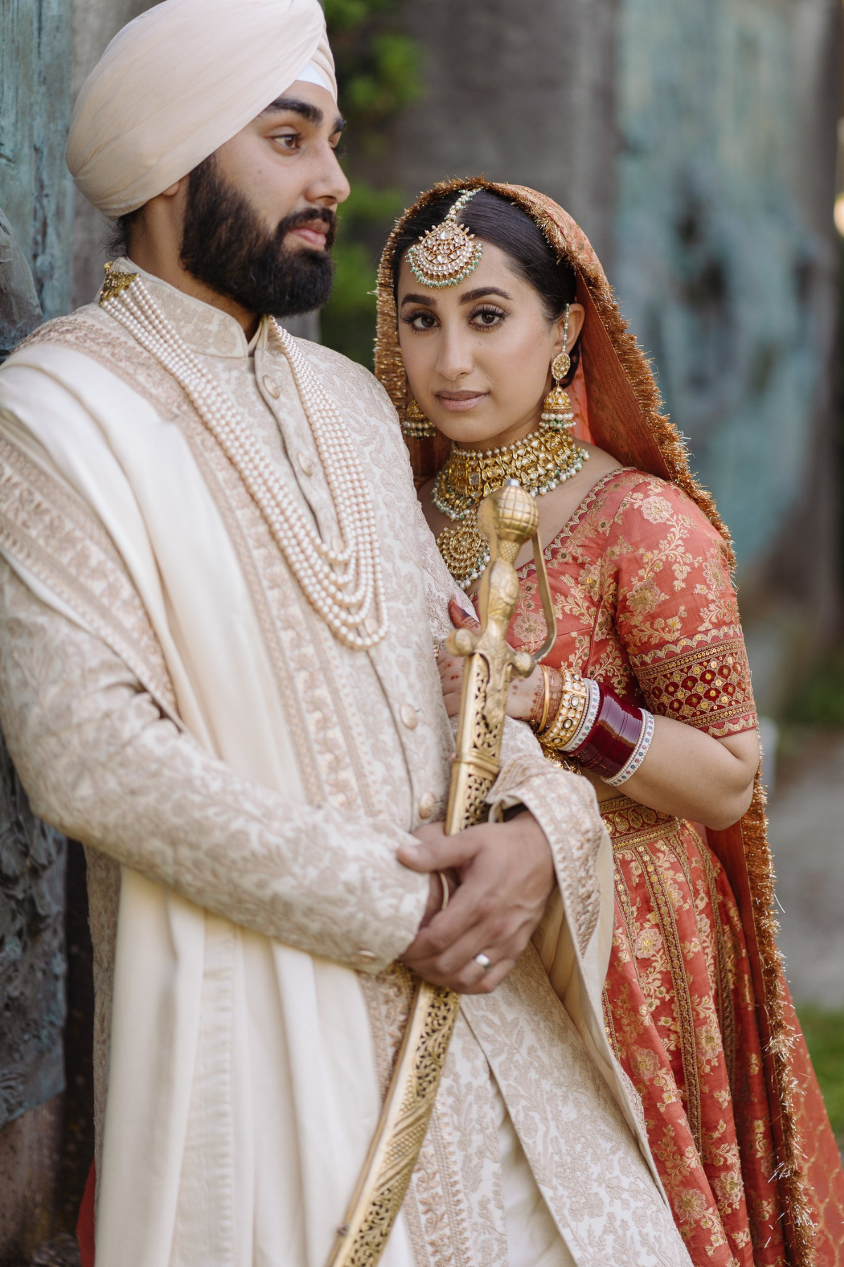 sikh-wedding-outdoor-bride-peach-lehenga-groom-ivory-sherwani