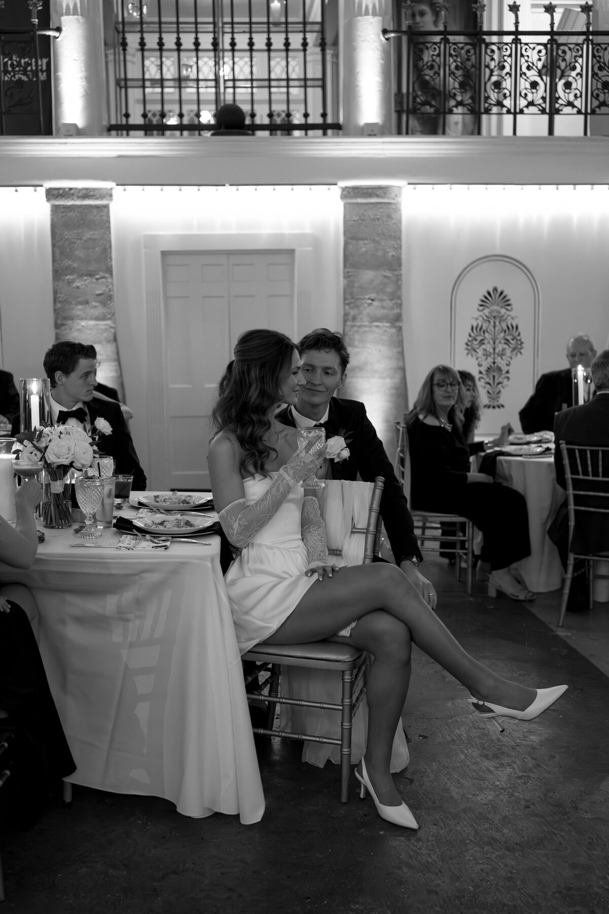 Groom glancing at Bride during reception by film wedding photographer Shelby Ann Photos