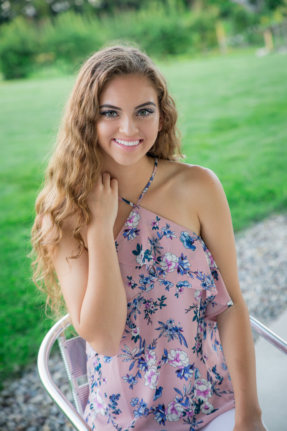 Senior picture with greenery in the background in Penn Yan, NY