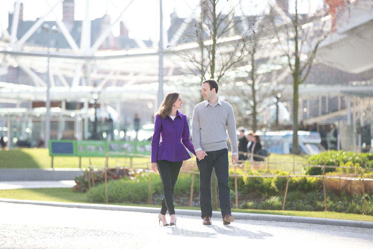 Couple strolling through urban park