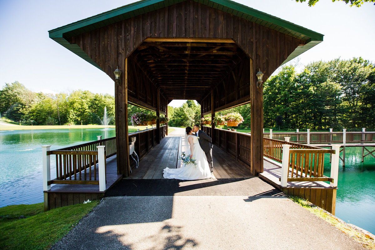 Bride and groom share first kiss at the end of their CHQ Barn wedding ceremony in Chautauqua, NY